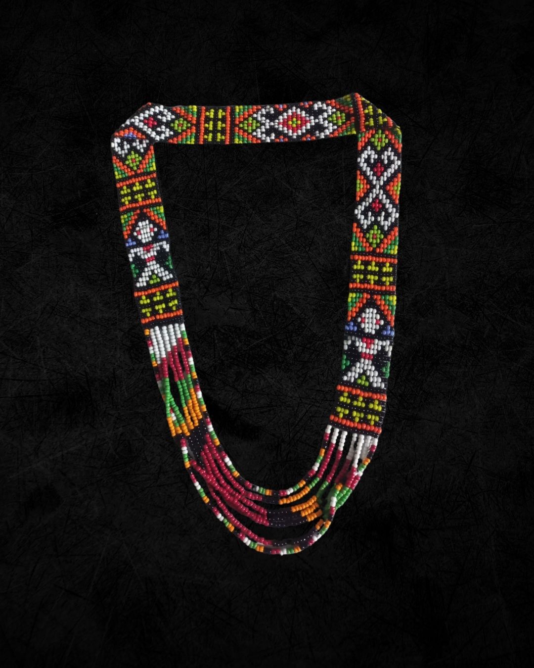 Colorful beaded necklace on a black background