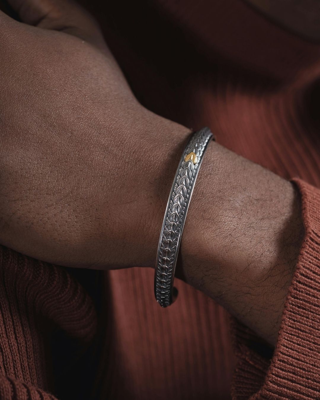 Traditional Dusun brass bracelet on a wrist