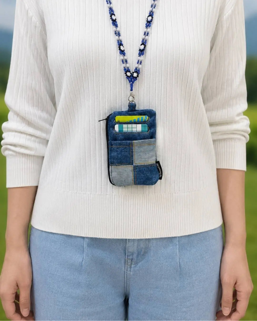 Styled with a handcrafted beaded neck strap.