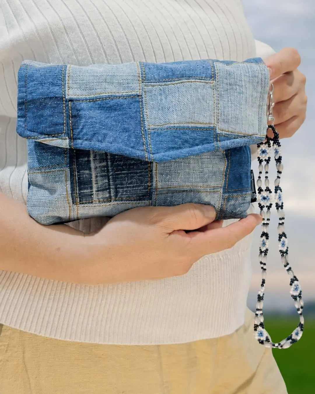 Styled with our beaded wrist strap.