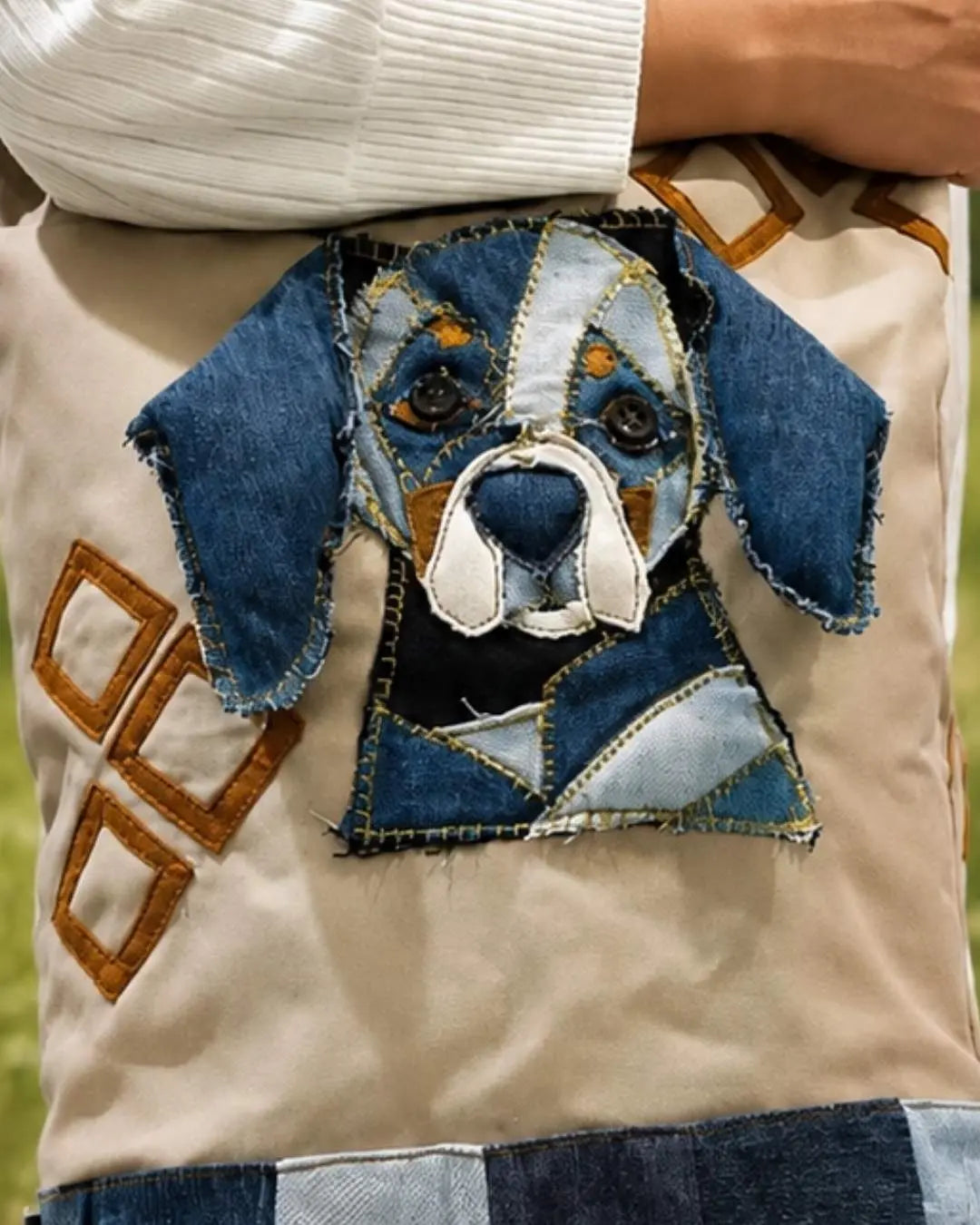 A closer look at the handcrafted 3D dog appliqué, thoughtfully created with upcycled denim.
