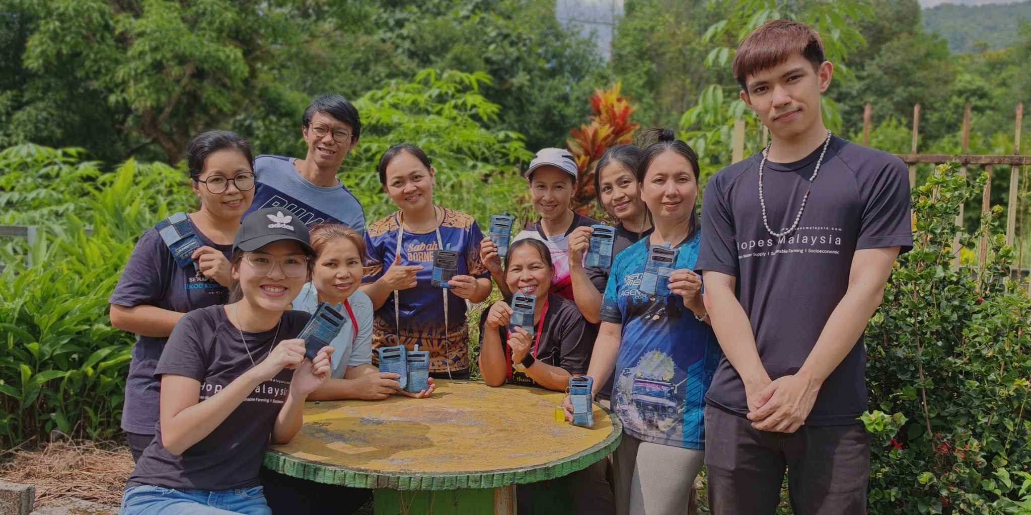 Hopes Malaysia team with rural women showcasing their handmade upcycled products.