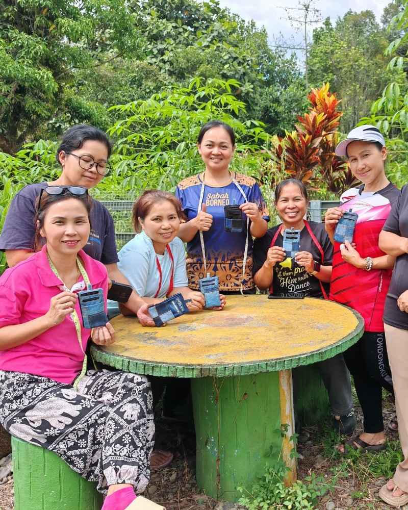 Rural women holding their handmade upcycled products