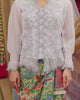 woman posing with beautiful hand sewn kebaya outfit