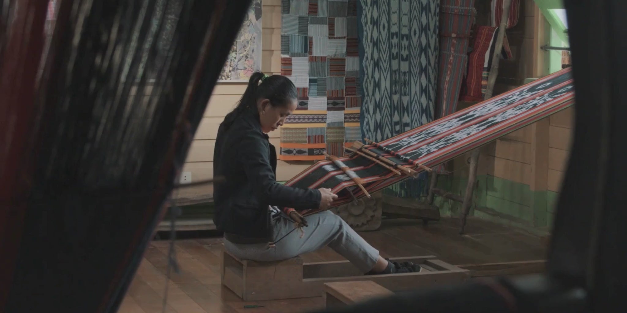rural woman weaving traditional cloth