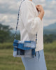 short video animation of a person carrying the envelope bag with beaded strap attached.